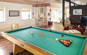 a living room with a pool table with balls on it at Apartment Sønderskovhedevej in Langå +15 photos