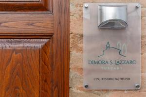 a sign on a door that reads dungeons islandaza tyson at Dimora San Lazzaro Tuscany in Cetona
