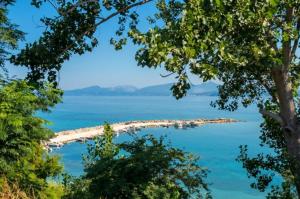 a view of the water from the shore of a beach at Holiday & Business Furnished Apartments in Mytikas