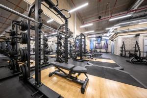 a gym with lots of tread machines and weights at Hotel Aréna in Jihlava