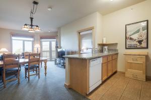 a kitchen and dining room with a table and a dining room at Sunstone 325 in Old Mammoth