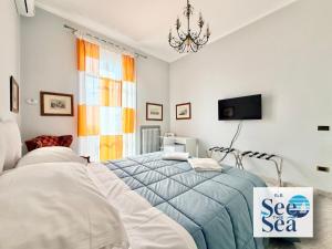 a bedroom with a bed and a sign that says see the sea at See The Sea B&B in Salerno