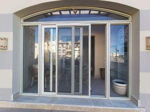 a sliding glass door on a building with a patio at OrientalCoast in Quseir +14 photos