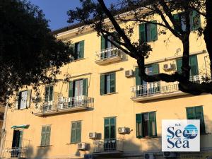 a building with a sign that says see the sea at See The Sea B&B in Salerno