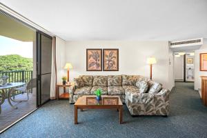 a living room with a couch and a table at Kaanapali Shores 512 in Kaanapali