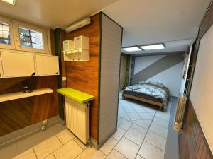 a small room with a bed in a bedroom at Appartement familial de 60 M2 in Angoulême +6 photos