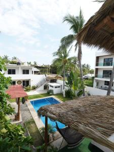 a view of the pool from the balcony of a resort at Suku'un in Brisas de Zicatela