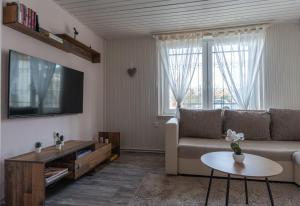 a living room with a couch and a table at Lagom Vendégház in Zalaszentgrót