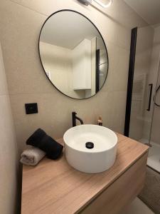 a bathroom with a white sink and a mirror at Lavand'in Durbuy in Durbuy +40 photos
