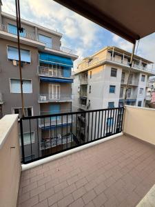 a balcony with a view of some buildings at appartamento la conchiglia in Rapallo