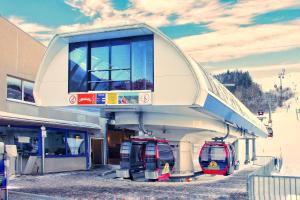 two cars are parked at a gas station at RELAX - ORANGE mit Pool und Sauna in Sonthofen
