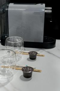 a group of glass bowls and chopsticks on a counter at SECRET JACUZZl & LOVE in Bucharest