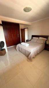 a large bedroom with a large bed in it at Sobrado de lazer rita in Aparecida de Goiânia +23 photos
