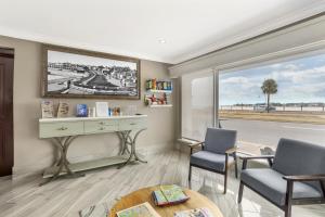 a room with two chairs and a desk and a window at Best Western Historic Bayfront in St. Augustine