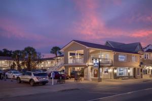a gas station with cars parked in a parking lot at Best Western Historic Bayfront in St. Augustine