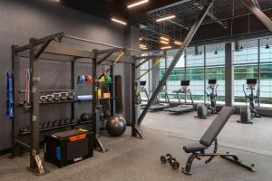 a gym with weights and equipment in a room at Hampton Inn By Hilton Calgary Downtown in Calgary