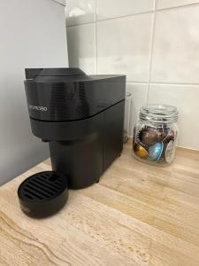 a coffee maker sitting on top of a counter at Spacious 2 bed apartment with private parking space in Edinburgh +2 photos