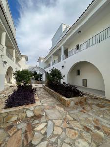 a stone walkway in front of a building at Kıbrıs Town House Menekşe in Aglantzia