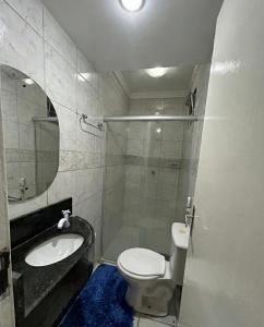 a bathroom with a shower and a toilet and a sink at Pousada Rio Doce in Olinda