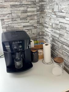 a coffee maker sitting on top of a counter at Schelder Unterkunft in Dillenburg +2 photos