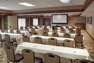 a conference room with tables and chairs and a screen at Hampton Inn & Suites Youngstown-Canfield in Canfield +52 photos