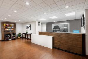 a waiting room with a counter in a store at Hampton Inn Naples-Central in Naples