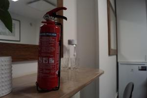 a red fire hydrant sitting on top of a counter at Brabo 1 in Landskrona