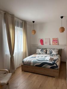a bedroom with a bed and a window at Solaria House in Montesilvano