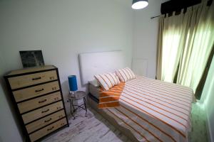A bed or beds in a room at Apartments Madrid Las Letras