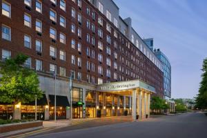 a building on a street in front of a building at Hilton Orrington/Evanston in Evanston
