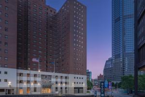 a large building in a city with tall buildings at DoubleTree by Hilton Hotel & Suites Pittsburgh Downtown in Pittsburgh