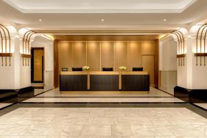 a lobby of a hotel with a reception desk at Hilton Prague Old Town in Prague