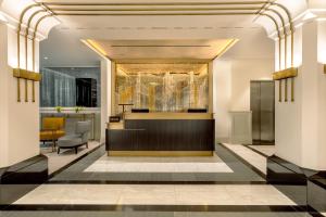 a lobby with a bar and a dining area at Hilton Prague Old Town in Prague