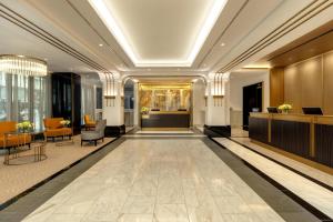 a lobby of a hotel with a reception desk at Hilton Prague Old Town in Prague +92 photos
