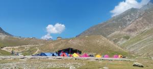 a group of colorful tents on a mountain at K2 Alpine Hotel in Pahalgām