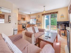 a living room with two couches and a table at Ted's Place in Bridlington
