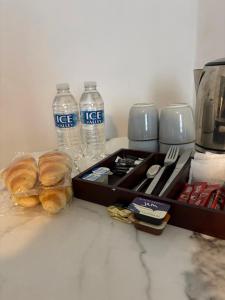 a box of water and some bread and water bottles at Piccolo in Glasgow