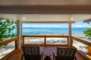 a view of the ocean from the porch of a beach house at Beachcomber Island Resort in Beachcomber Island
