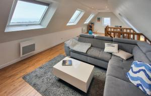a living room with a couch and a table at Kerarmoor in Plouhinec