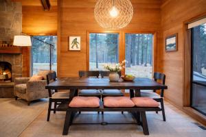 a dining room with a table and chairs and a fireplace at Glaze Meadow 129 in Redmond +17 photos