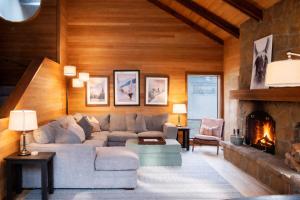 a living room with a couch and a fireplace at Glaze Meadow 129 in Redmond