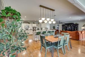 a kitchen and dining room with a table and chairs at Spacious Getaway By Wolf Pen Gap 15 Acres and Pool! in Mena