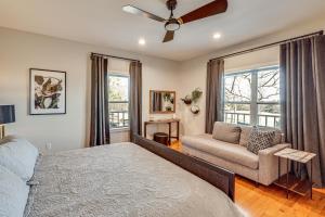 a bedroom with a bed and a couch at Spacious Getaway By Wolf Pen Gap 15 Acres and Pool! in Mena +37 photos