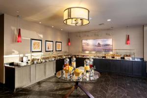 a restaurant with a table with food on it at Doubletree By Hilton Billings in Billings