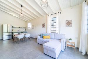 a living room with a couch and a table at Casa Norma in Mayaguez in Hacienda Constanza