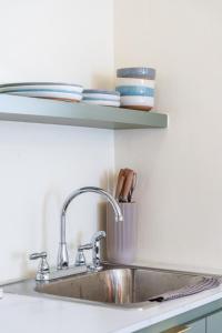 a kitchen counter with a sink and a shelf at Casa Norma in Mayaguez in Hacienda Constanza +26 photos