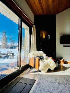 a living room with a couch and a sliding glass door at Lodge Condo 004 in Black Butte Ranch
