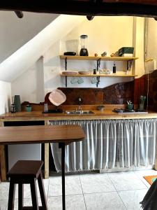 a kitchen with a sink and a wooden counter top at Casa Ametista in Lençóis