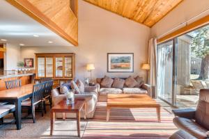 a living room with a couch and a table at Lodge Condo 022 in Black Butte Ranch