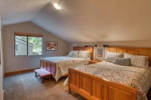 a bedroom with two beds and a window at Lodge Condo 022 in Black Butte Ranch +2 photos
